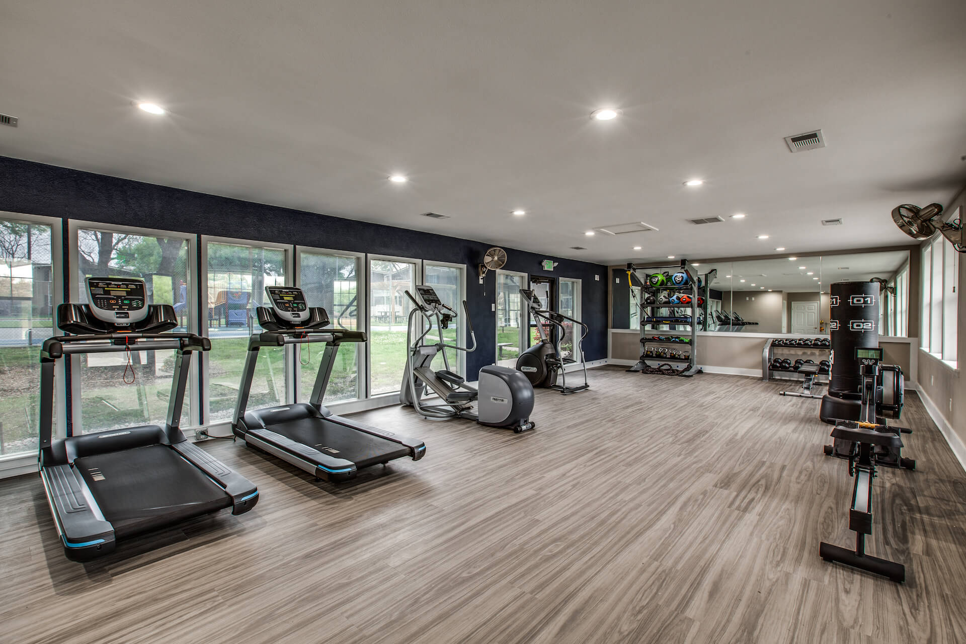 fitness center with free weights, treadmills and more